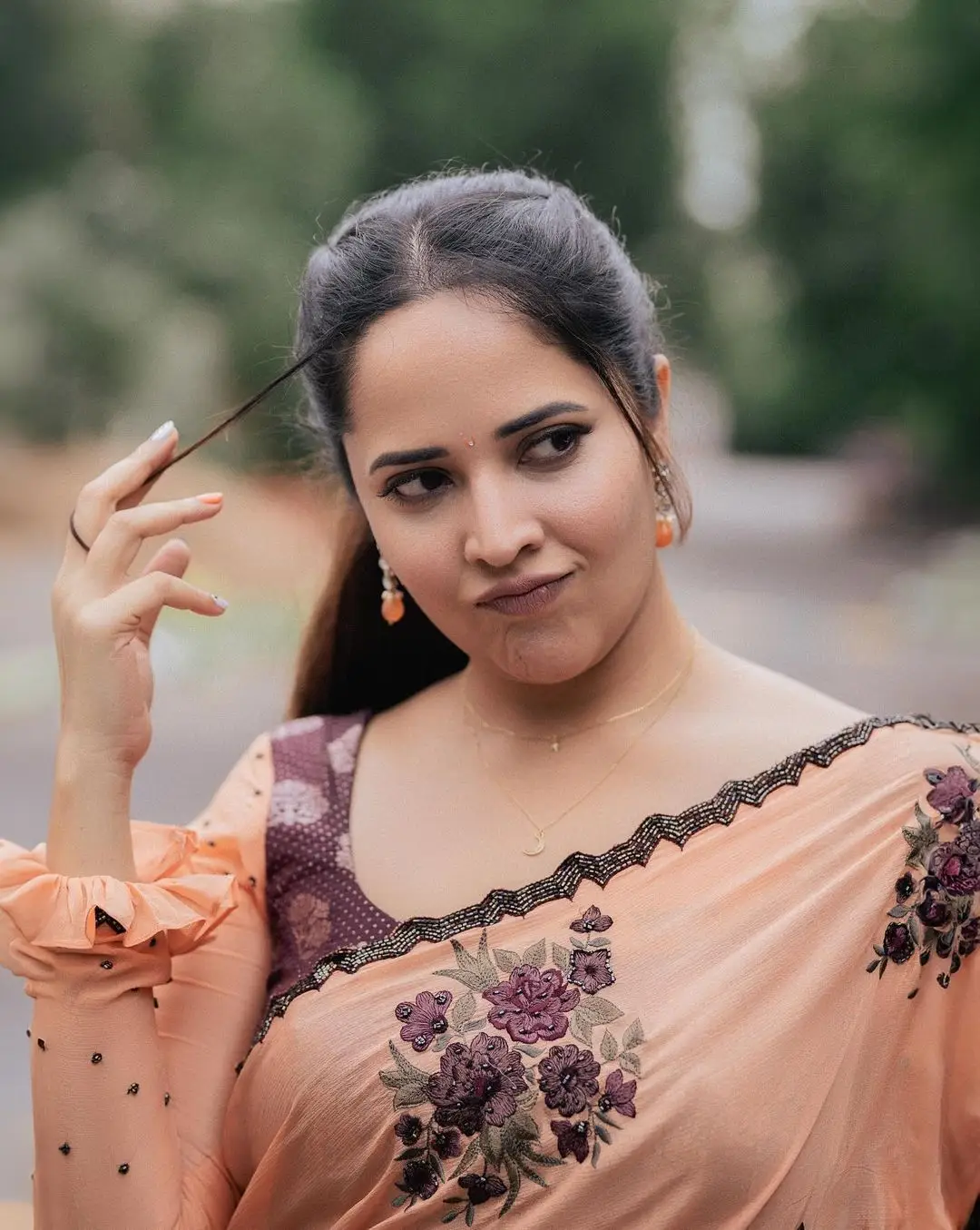 Anasuya Bharadwaj Wearing Beautiful Earrings Orange Saree Blouse